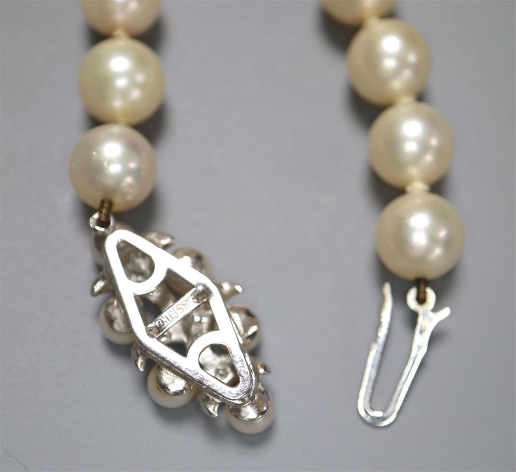A modern single strand cultured pearl necklace with diamond set 585 white metal, cultured pearl and diamond set clasp,
